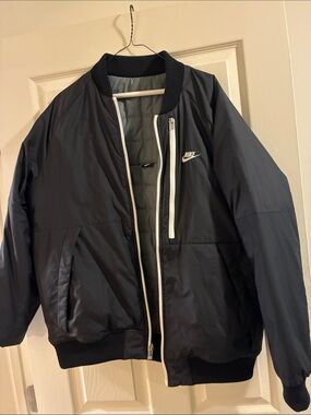 Nike Black Men’s Bomber Jacket with White Zipper Accents